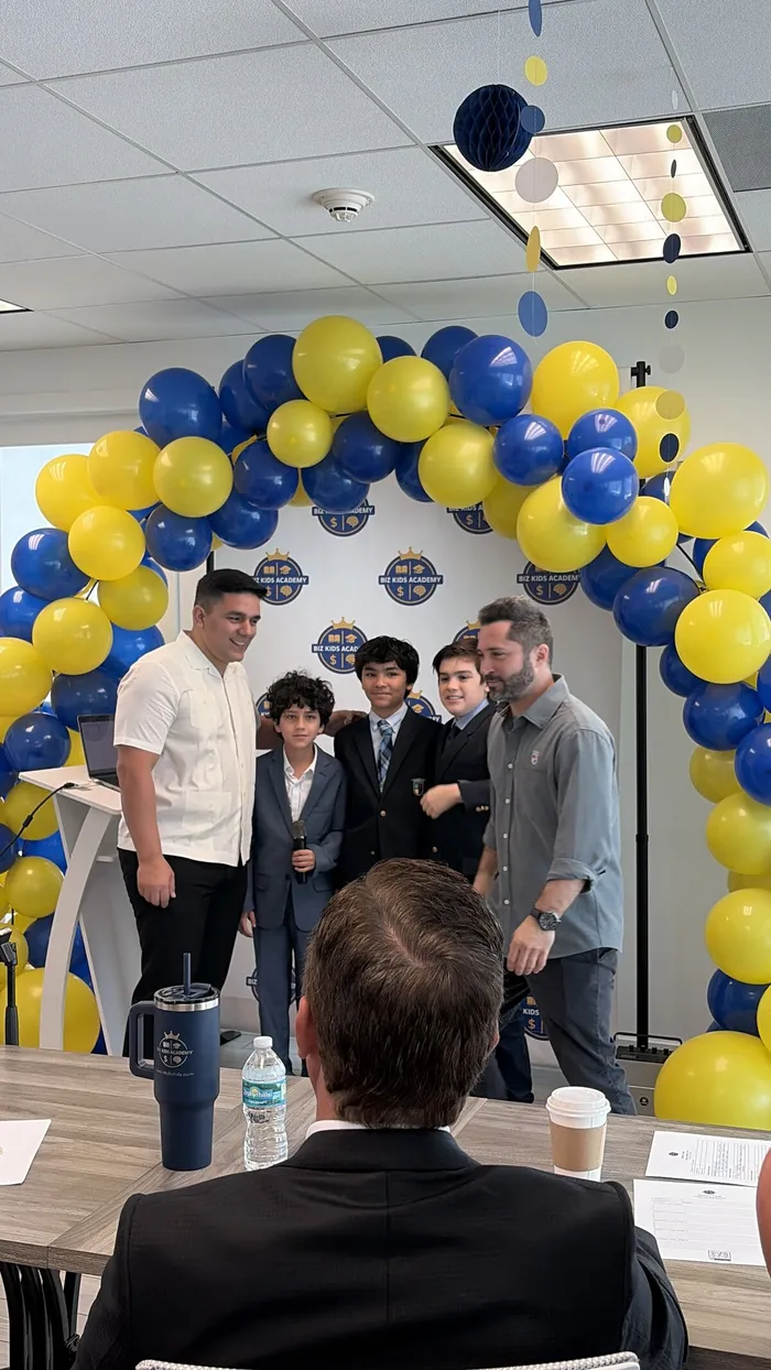 Commissioner Rolando Escalona with Biz Kids Academy students